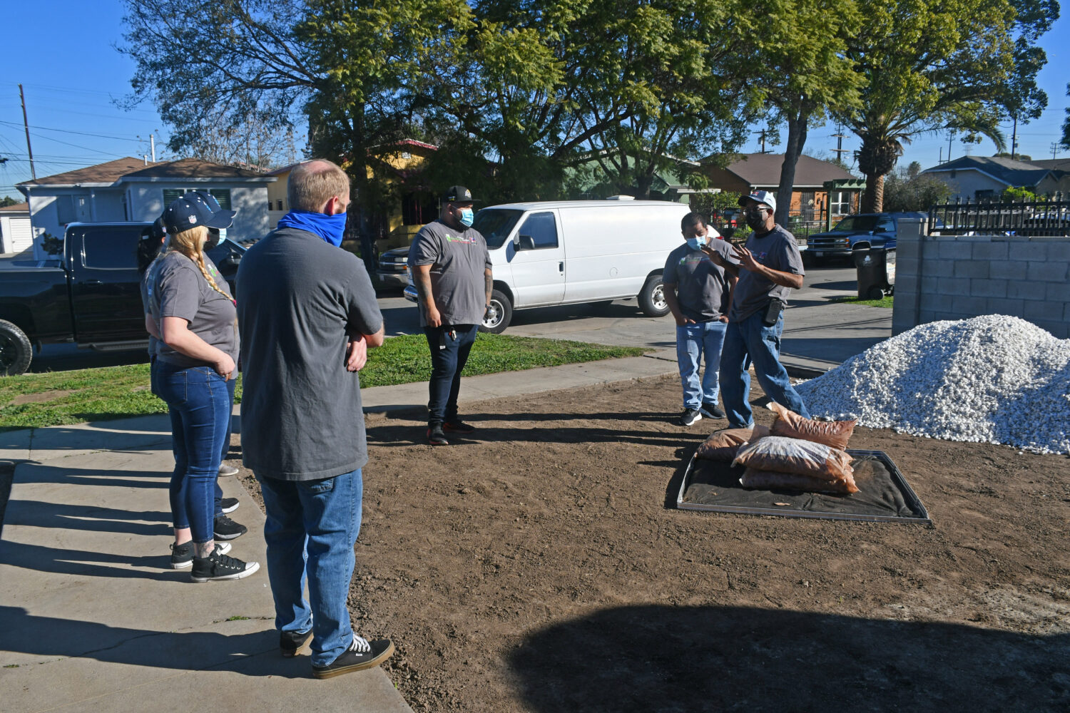 Men and women working outside.