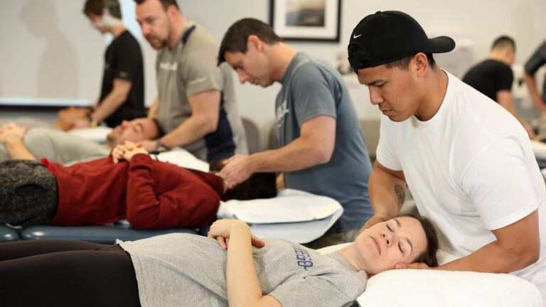 USC physical therapy students practicing what they are learning on their classmates