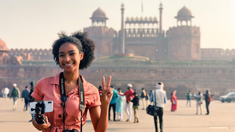 Student with a camera and phone in India