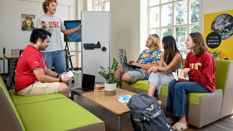 Students conversing in the Sustainability Hub