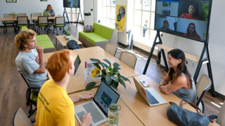 Students in the Sustainability Hub have a hybrid discussion