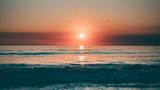 the sun setting at Santa Monica Beach