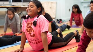 USC Dornsife’s Joint Educational Project helps local kids manage stress, find focus through yoga