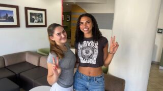 Roomies at first sight: Aryana Cayton, left, and Jade Alvarez show their Trojan spirit in their new home at Birnkrant Residential College. (USC Photo/Greg Hernandez)