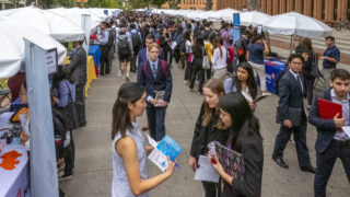 USC student and recruiting companies gather on Trousdale Parkway for USC Career Center's Fall Career Fair